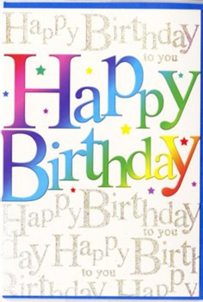 In this photograph, a contemporary birthday card stands upright, its front transformed into a joyful canvas of layered lettering and subtle sparkle. The central focus is the phrase "Happy Birthday," printed in large, rounded letters that look almost hand-painted, each one filled with a soft, flowing gradient. The colours travel seamlessly from rich crimson at one edge of the phrase through fuchsia and violet into cool turquoise, then on to fresh lime, mellow chartreuse, and finally a glowing, buttery yellow. The effect brings to mind a row of carefully chosen blooms on a florist's bench in Old Oak Common, graduating from deep, passionate tones to bright, sunny hues. Behind this cheerful headline, the card's background is completely covered with repeating lines of elegant cursive script, the words "Happy Birthday to you" written over and over in fine, looping strokes. The ink is a metallic gold, with a subtle glittered sheen that catches available light, creating a gentle shimmer rather than a harsh sparkle, like morning sun glancing off wet leaves in a local park near Old Oak Common Lane. Here and there, tiny starbursts and dots in coordinating colours add a sense of fun and motion, as if imaginary confetti has settled on the card after a celebration. The surface of the card appears smooth, likely with a satin finish that would feel soft under the fingertips. The lighting in the image is calm and even, so every letter remains crisp and readable, and the gradients appear deep and saturated. This is a card that visually sings "celebrate," perfect to nestle alongside a fresh birthday bouquet ordered for delivery in and around Old Oak Common.
